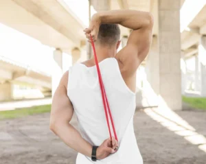 man doing a resistance band workout